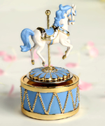 Blue in golden horse music box